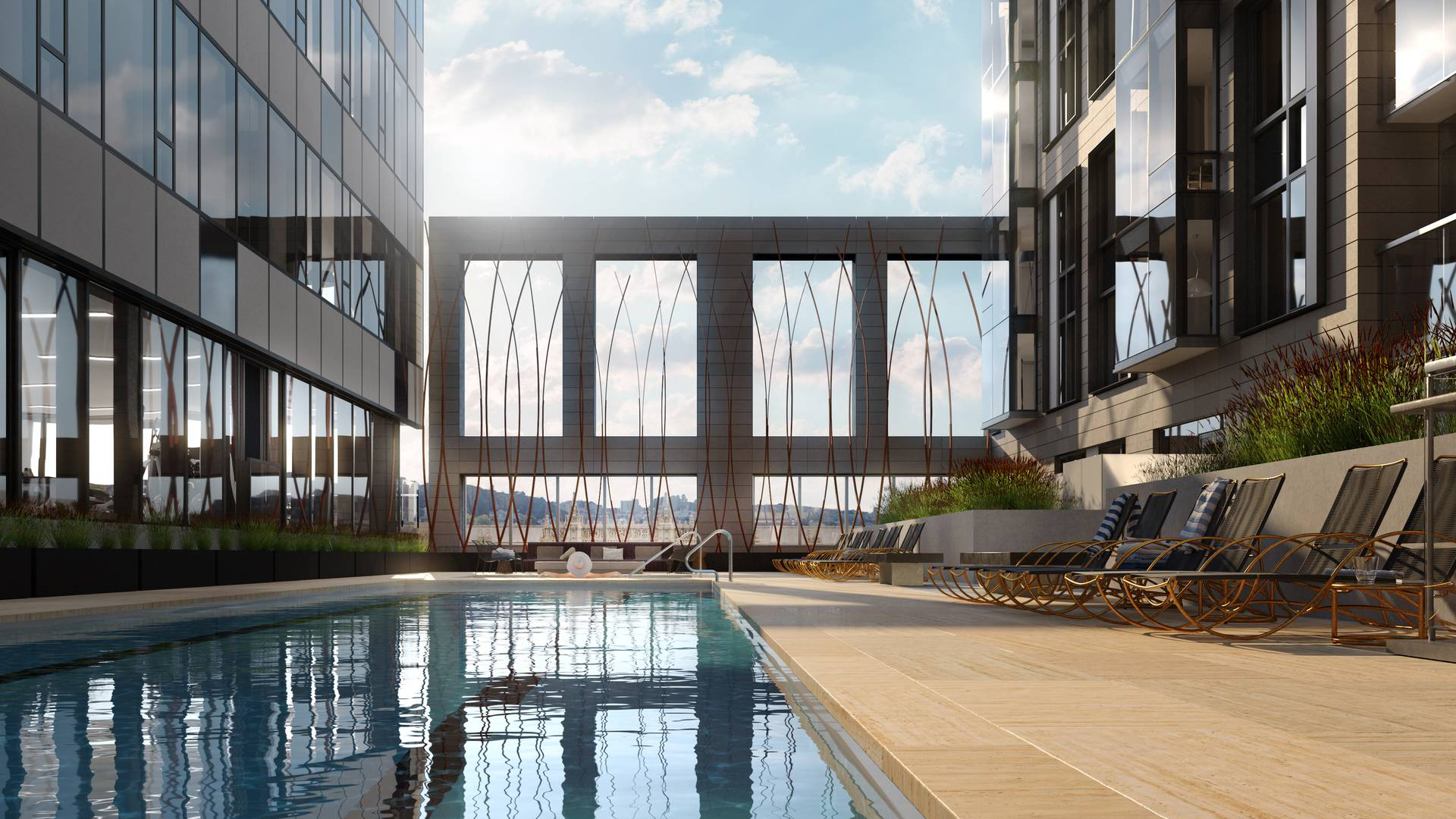 A deep, blue swimming pool located on a roof deck of an apartment.